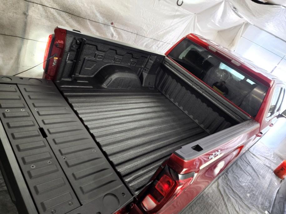 Red Truck Bed with spray on Bed-liner.